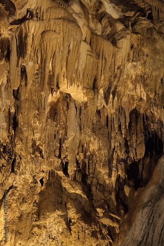 Rock formations of Betharram caves in France during a serene midday excursion photo