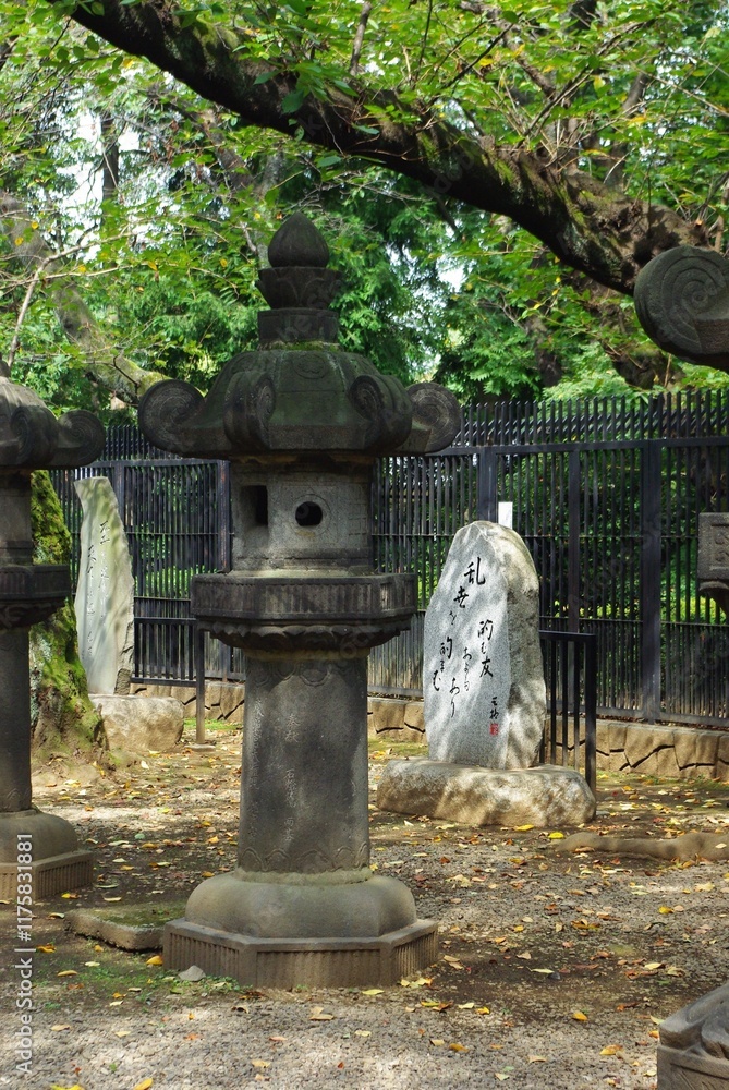 Traditional Japanese stone lantern in a serene garden setting Traditional Japanese stone lantern in a serene garden setting