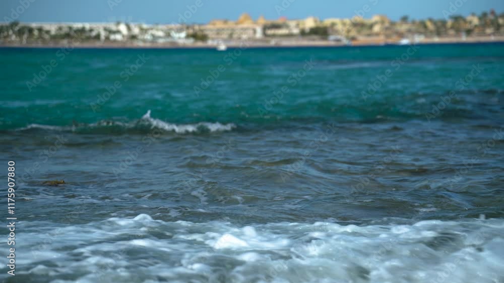 Sea waves against the backdrop of a city on the Egyptian coast Sea waves against the backdrop of a city on the Egyptian coast