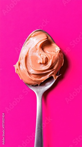 Wallpaper Mural Creamy Peanut Butter on Spoon against Vibrant Pink Background Torontodigital.ca