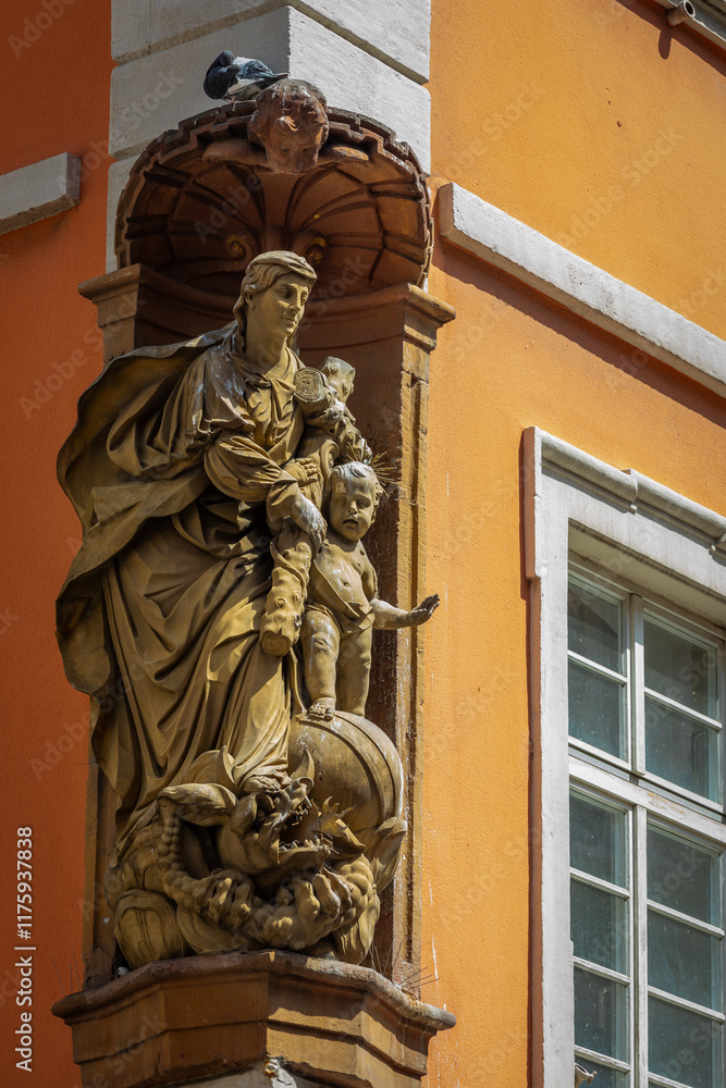Baroque Stone Statue of Madonna with Child in the Pedestrian Zone of the City Heidelberg, Germany, on a sunny Summer Day Baroque Stone Statue of Madonna with Child in the Pedestrian Zone of the City Heidelberg, Germany, on a sunny Summer Day