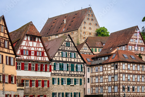 Historic half-timbered Houses with colorful Facades and Kocher River in Foreground in the City of Schwäbisch Hall, Germany; Close-up