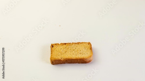 Close-up of a neatly stacked pile of golden-brown rusks. The texture appears crisp and the color is consistent throughout. Simple, delicious, and ready to eat.