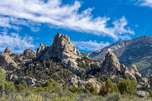 Patches of snow on the mountains behind the rock formations of Castle Rocks State Park, Idaho, USA