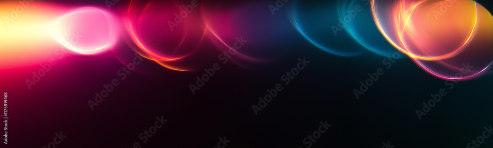 Fototapeta premium Abstract light trails creating vibrant circles on dark background