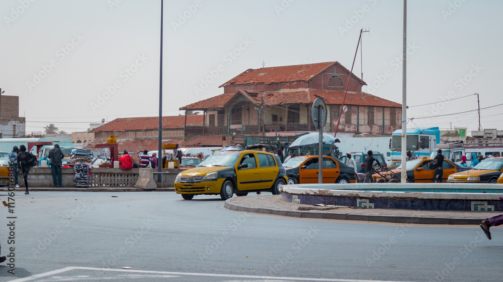 Former train station building in Sant Louis, collonial city on the north of Senegal. Here used to be a railroad track to dakar, now a busy market.