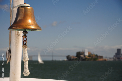 San Francisco, CA, USA. April 24, 2012: Boat bell overlooking Alcatraz Island in San Francisco Bay.
