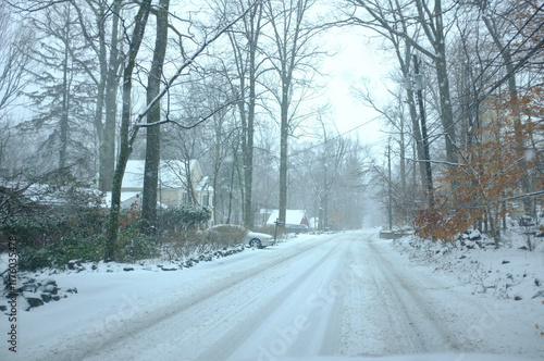 driving county road at the beginning of a snowstorm in February in New Jersey