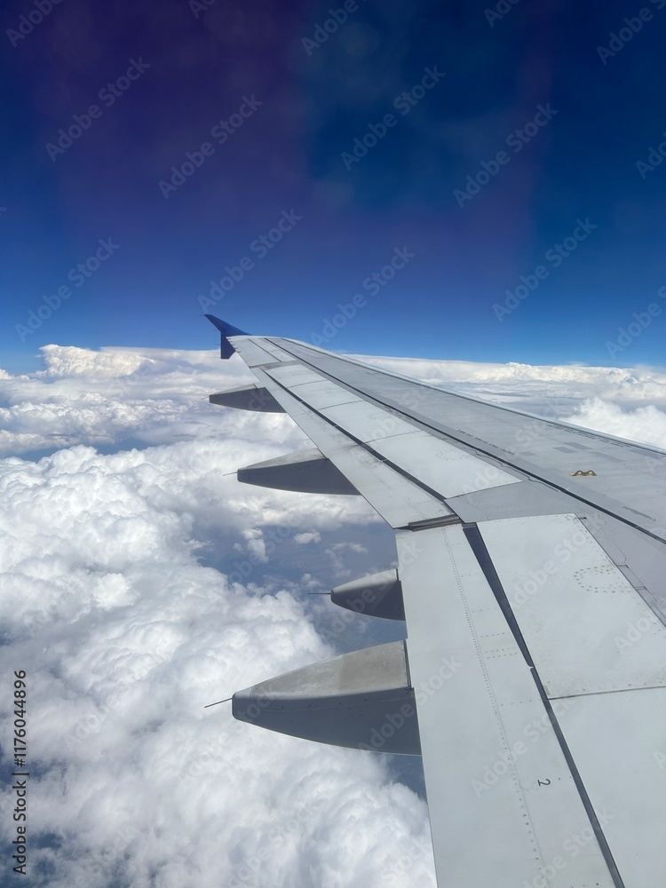 view from airplane window up in the clouds view from airplane window up in the clouds
