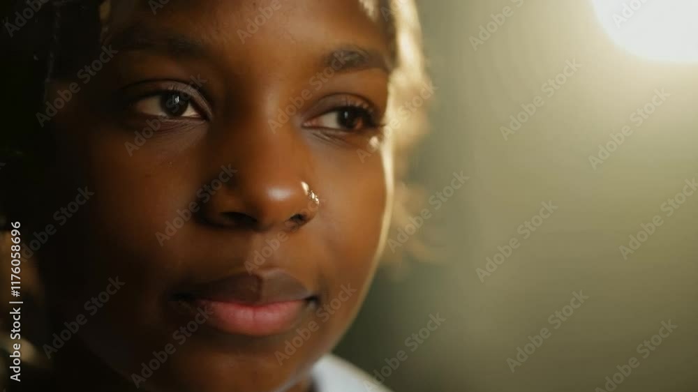 Young black woman closing eyes in thoughtful expression Young black woman closing eyes in thoughtful expression