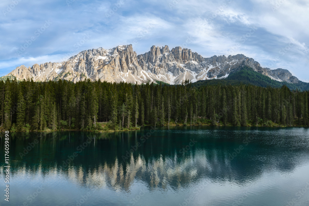 Stunning view of Lago di Carezza in Dolomite Alps which mirror the surrounding landscape Stunning view of Lago di Carezza in Dolomite Alps which mirror the surrounding landscape