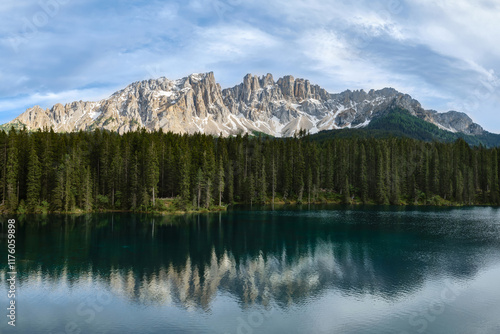 Stunning view of Lago di Carezza in Dolomite Alps which mirror the surrounding landscape
