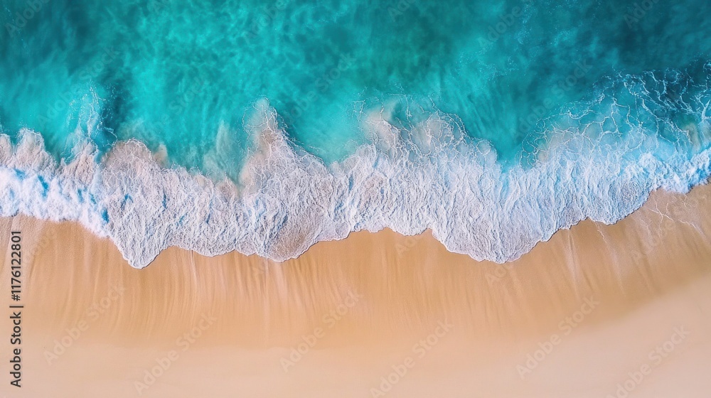 Aerial view of turquoise ocean waves breaking on a sandy beach. Aerial view of turquoise ocean waves breaking on a sandy beach.
