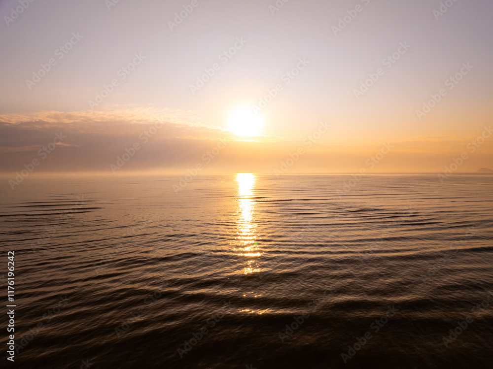 Fototapeta premium Aerial view sunset sky,Nature beautiful light sunset or sunrise over sea,Colorful scenery sunset sky,Amazing clouds and waves texture, sunrise sky background