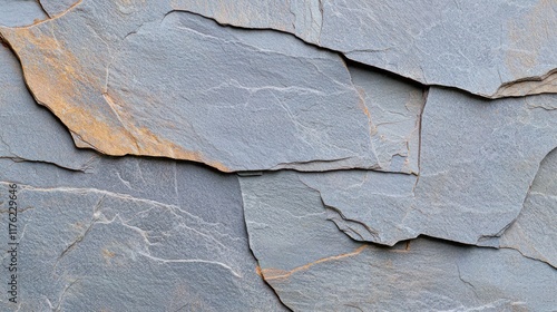 Close-up of layered slate stone with texture and color variations.