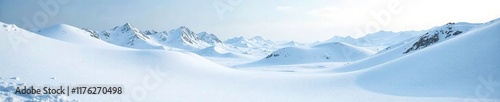 Snow-covered terrain with rolling mounds and hills, winter landscape, frozen ground, snowy terrain photo