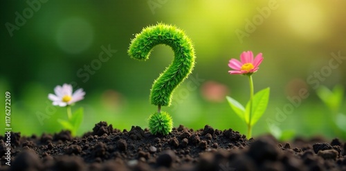 Green question mark flowers emerging from ground, soil, earthy, ground