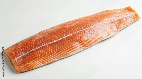 A raw salmon steak with skin on, ready to be cooked or grilled. photo