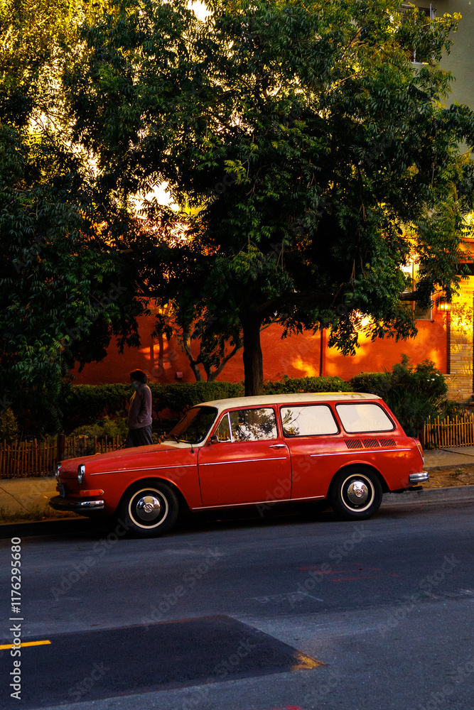 Fototapeta premium Red car parked on a red street in Oakland, california