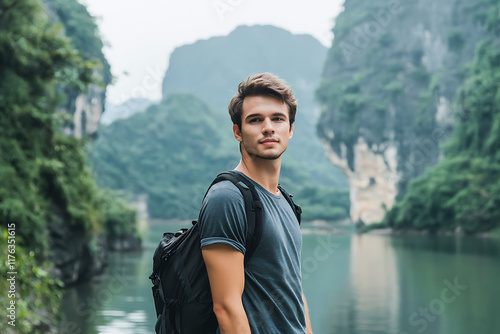 Tourist enjoying breathtaking view of river and limestone mountains in trang an scenic landscape complex photo