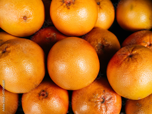 Group of pile fresh oranges fruit background. Close-up peel skin of orange, sweet and sour organic vitamin c fruits, creative summer concept. photo