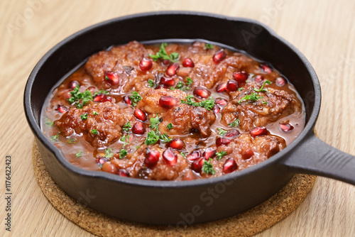 pomegranate chicken in skillet photo