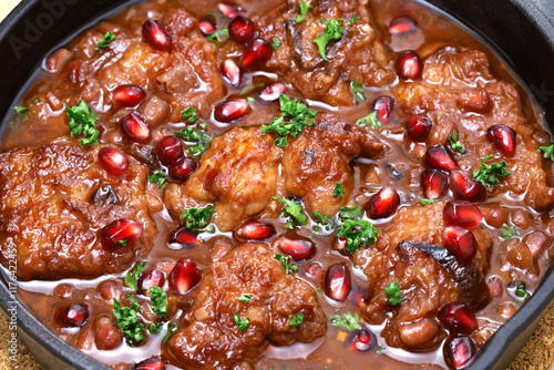 pomegranate chicken in skillet photo