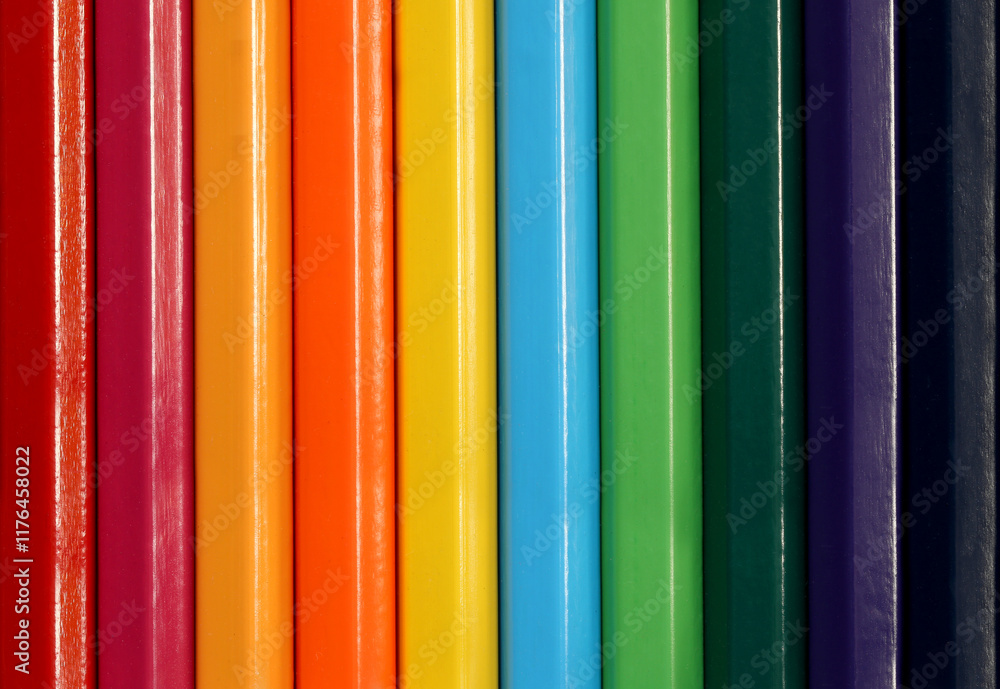 Colorful Vertical Stripes of Bound Books Showcasing a Spectrum of Vibrant Tones from Red to Purple on a Smooth Surface in Close-Up Perspective Colorful Vertical Stripes of Bound Books Showcasing a Spectrum of Vibrant Tones from Red to Purple on a Smooth Surface in Close-Up Perspective
