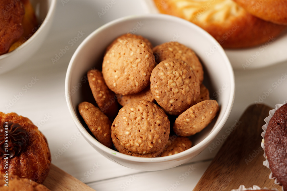 Delicious assortment of freshly baked cookies served in a bowl at a cozy gathering Delicious assortment of freshly baked cookies served in a bowl at a cozy gathering