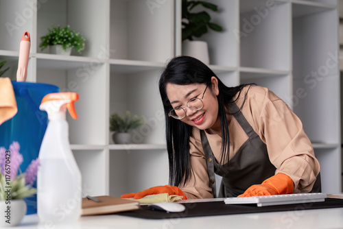 Housekeeper cleaning home office modern workspace image of a maid in action indoor environment close up view concept of cleanliness photo