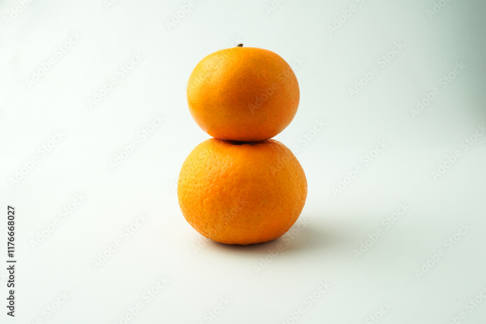 Ripe tangerines and Green orange leaves isolated on white background. Concept for Chinese Lunar New Year. Ripe tangerines and Green orange leaves isolated on white background. Concept for Chinese Lunar New Year.