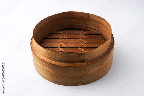 Close-up photo of Wooden dimsum steamer container isolated on white background. Shot on 30 Degree, flat lay angle setup photo