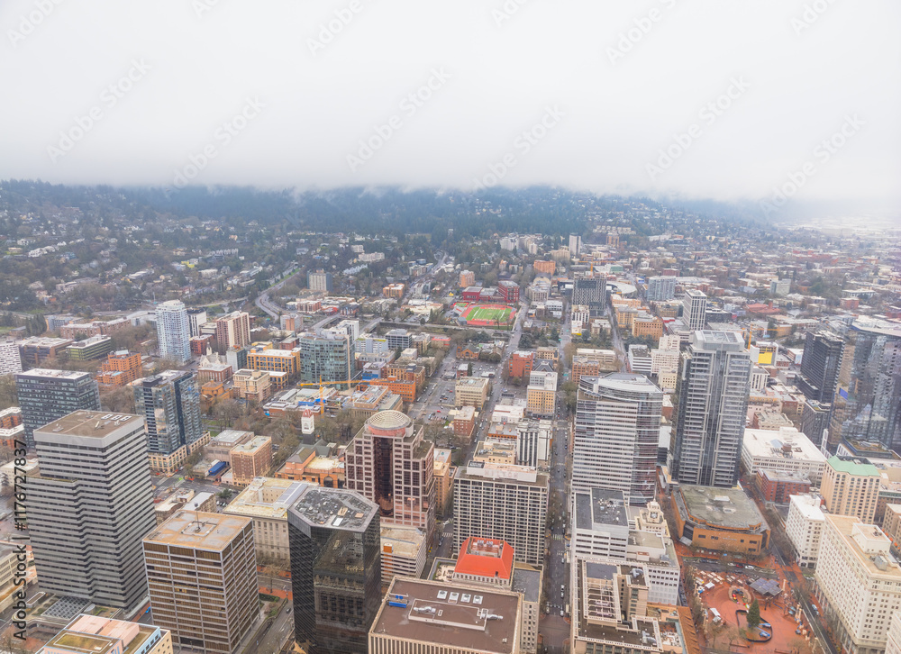 A city view with a cloudy sky and tall buildings