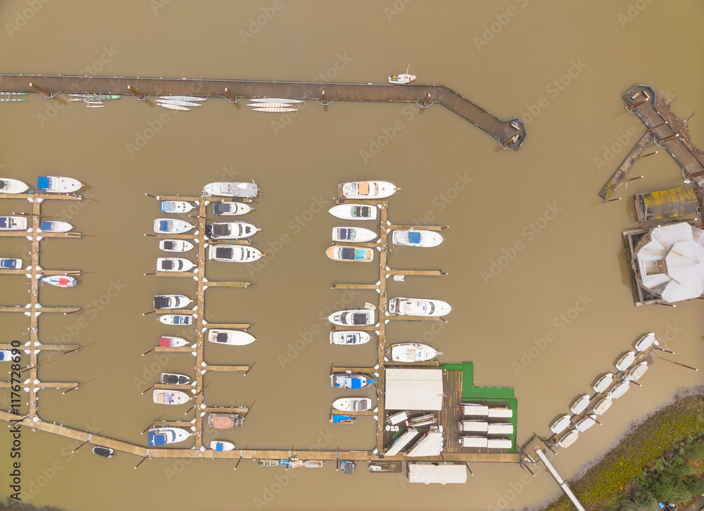 A view of a marina with many boats docked