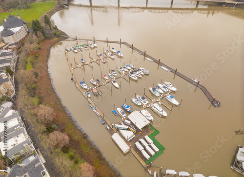 A view of a marina with many boats docked