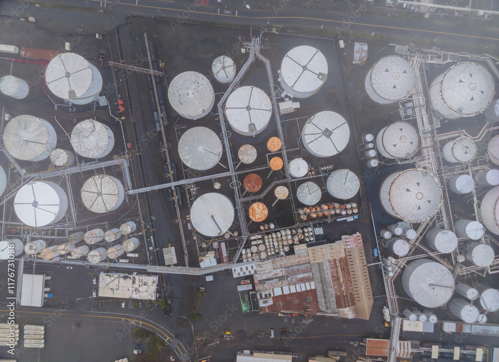 A large industrial area with many tanks and pipes