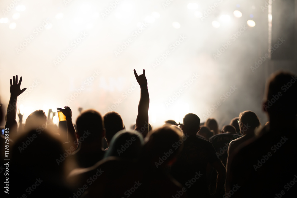 Fototapeta premium Crowd at concert and blurred stage lights.