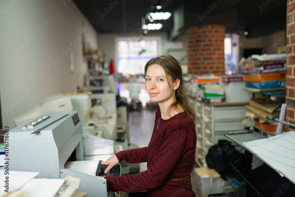 Woman using printer machine in office Woman using printer machine in office