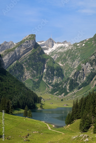 Scenic view of Seealpsee lake with S�ntis mountain in the background, located in the Appenzell Alps, Switzerland. photo