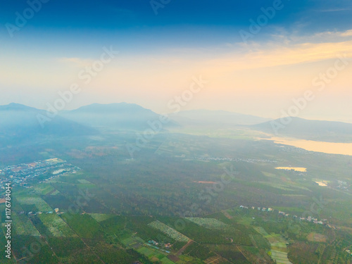 Aerial view of Bien Ho Che or Bien Ho tea fields, outside Pleiku city, Gia Lai province, Vietnam. Nature landscape, mountain and foggy far away. photo