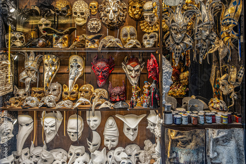 Vibrant display of handcrafted masks in an arts and crafts shop in Venice showcases traditional and carnival masks