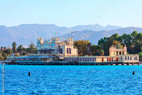 Obraz na płótnie Mondello beach in Palermo, Sicily Italy. Ornate building situated on a pier at seaside, with mountains visible in the background w salonie