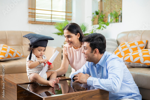 Baby In Black Graduation Cap Holding Diploma Education In His Hand