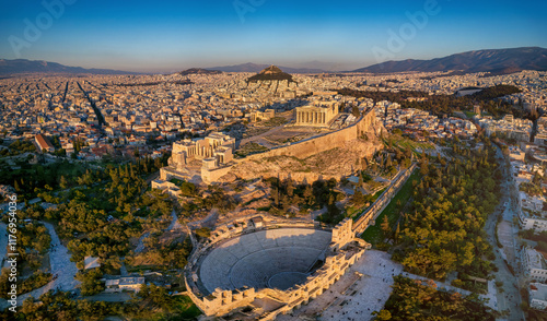 Fototapeta Naklejka Na Ścianę i Meble -  Panoramic aerial view of the Parthenon Temple and the Odeon of Herode theatre at the Acropolis of Athens, Greece, in golden sunset light