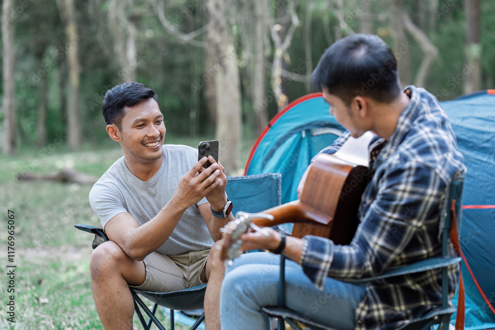Fototapeta premium Happy Couple Enjoying a Relaxing Camping Trip in the Forest with a Tent and Guitar