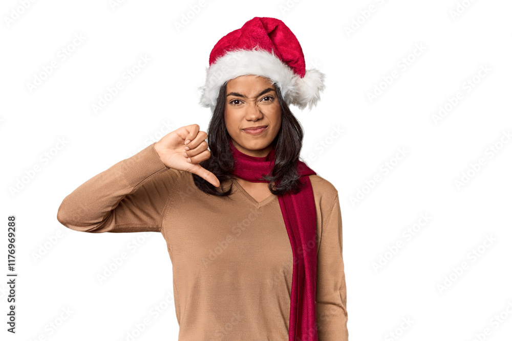 Filipino in Christmas attire and Santa hat showing a dislike gesture, thumbs down. Disagreement concept. Filipino in Christmas attire and Santa hat showing a dislike gesture, thumbs down. Disagreement concept.
