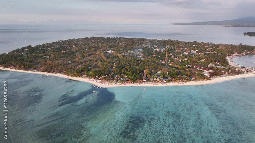 Aerial View Of Beach Resorts On Gili Air Island During Sunset In Lombok, Indonesia. Wide, Approaching Shot Aerial View Of Beach Resorts On Gili Air Island During Sunset In Lombok, Indonesia. Wide, Approaching Shot