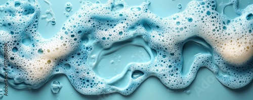 Soap suds and foam creating bubbles on blue background