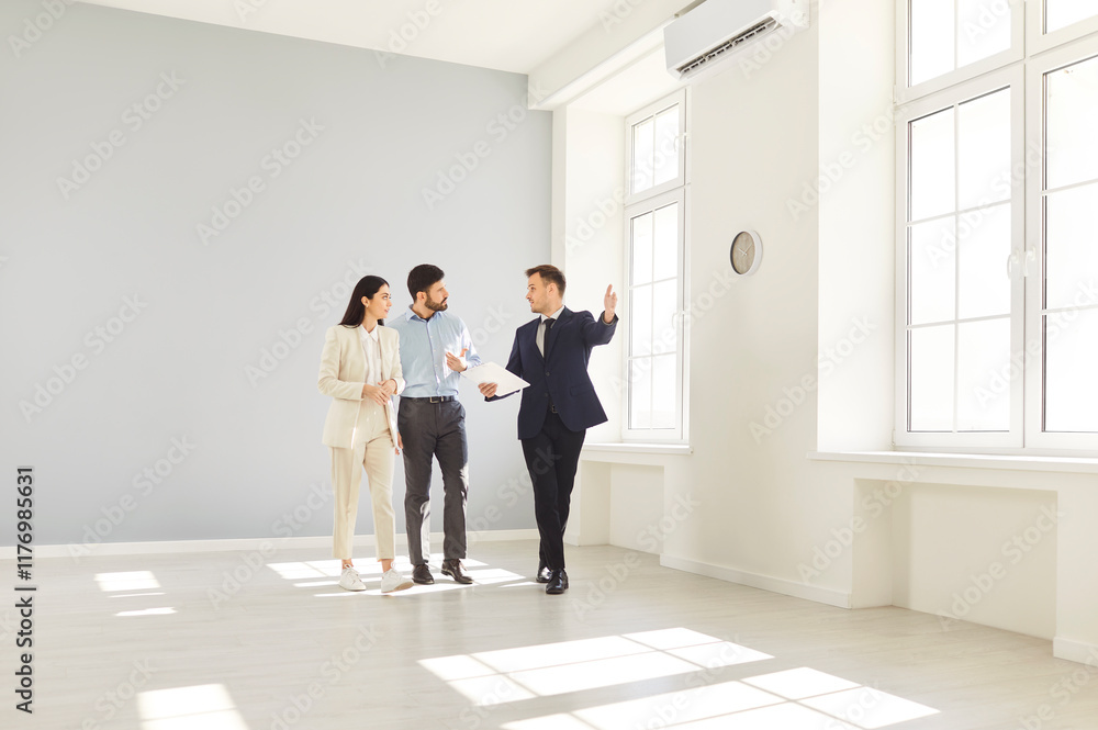Fototapeta premium Realtor presenting, licensed real estate agent, salesperson advertising property to couple family, helping to buy, sell, rent apartment, commercial properties, consulting on market price, mortgage