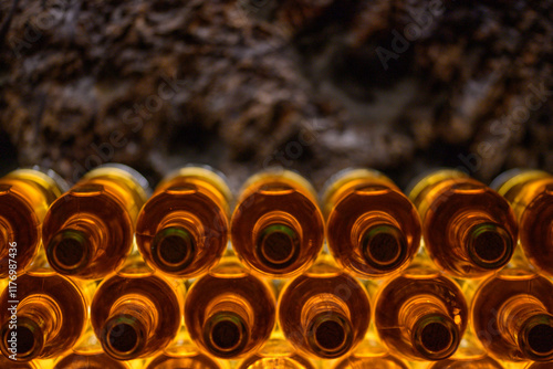 Quadro su tela Stacked backlit Wine bottles in a traditional Tokaj Wine cellar